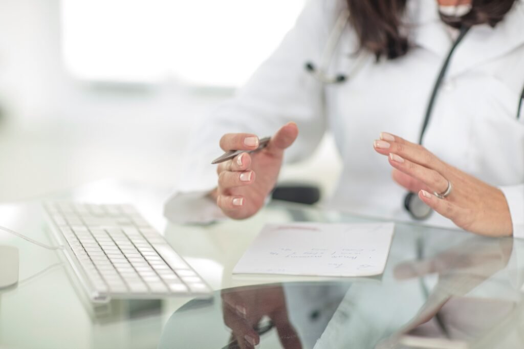 Cropped view of doctor diagnosing patient
